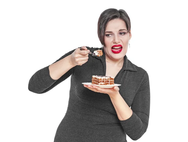 Plus size woman does not want to eat cake isolated — Zdjęcie stockowe