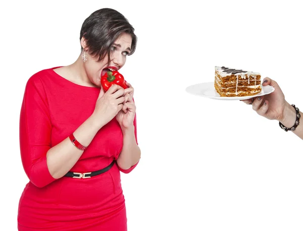 Plus size woman making choice between healthy and unhealthy food — Stock Photo, Image