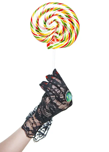 Kleurrijke lolly in vrouw hand geïsoleerd — Stockfoto