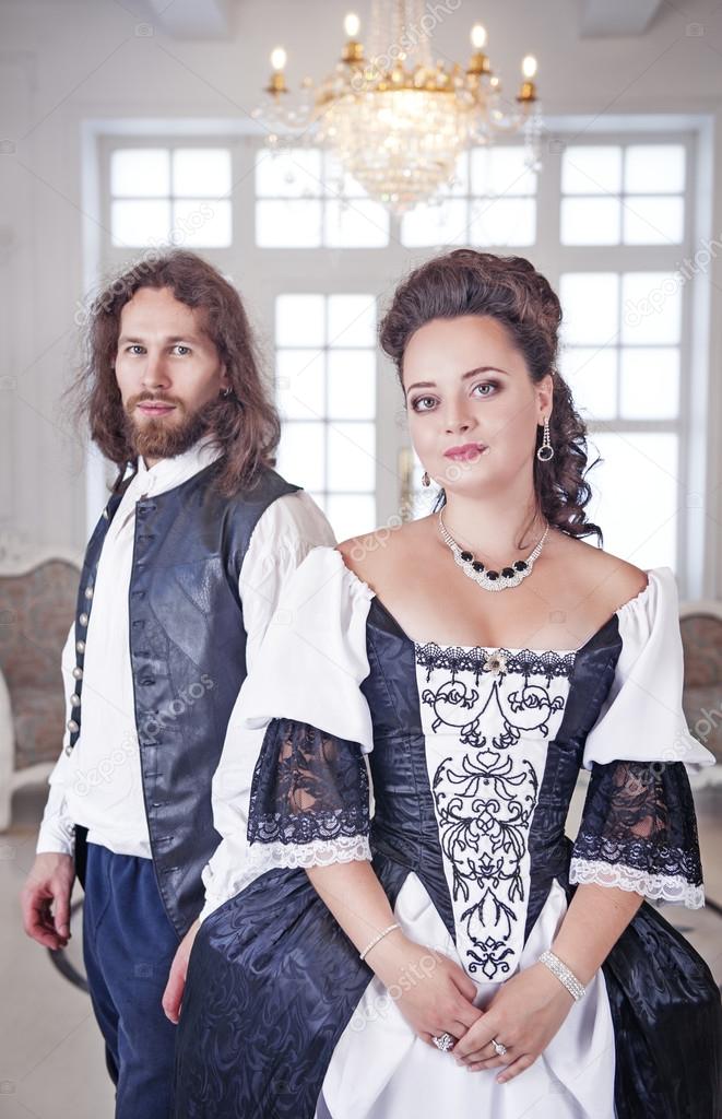 Beautiful couple woman and man in medieval clothes 