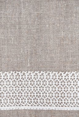 Dantel kumaş üzerine çuval bezi ile antika arka plan 