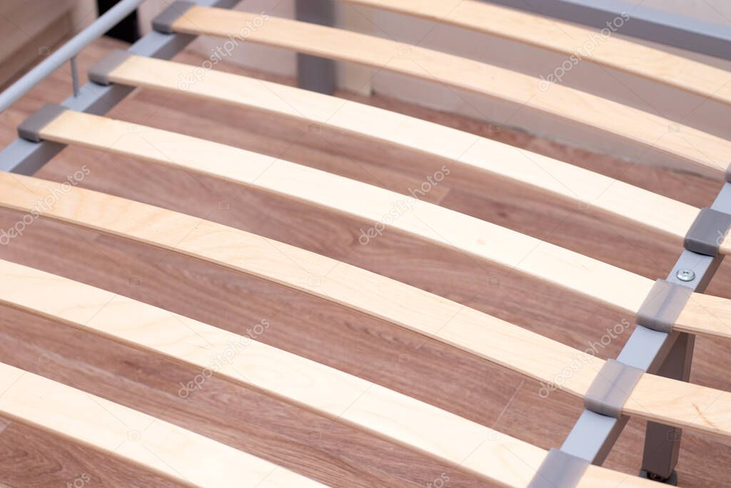 Wooden slats of a double bed. Birchen an arthopedic base of a bed