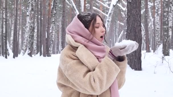 Happy Young Woman Eco Fur Coat Winter Forest Blowing Show — Stockvideo