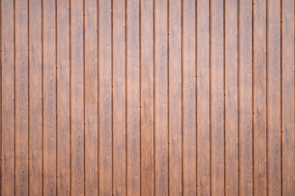 Wall made of brown wooden vertical planks texture