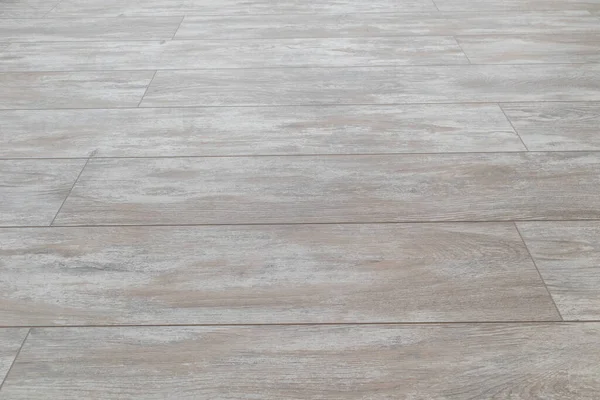 New vinyl laminate floor tile. Top view. White wood bevel laminate Floor