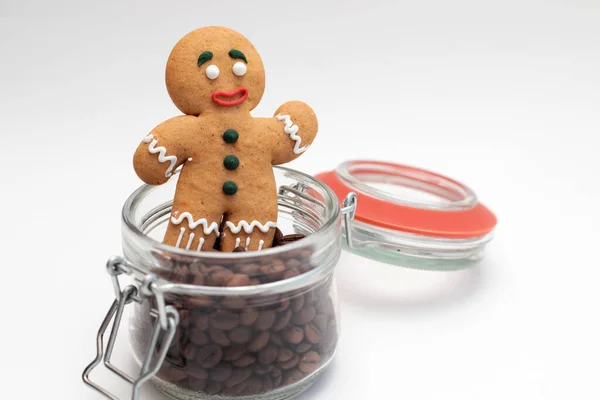 Gingerbread coockie in glass jar with coffee beans.