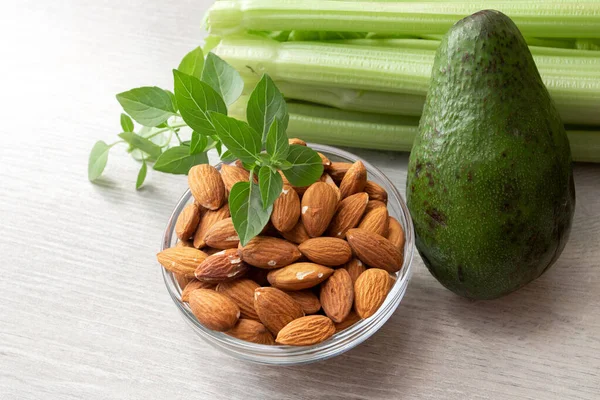 Fresh Vegetables Avocado Celery Almonds Table — Stock Photo, Image