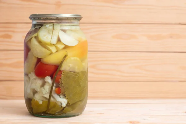 Pickles in a glass jar. Canning vegetables food. Marinated preserving.