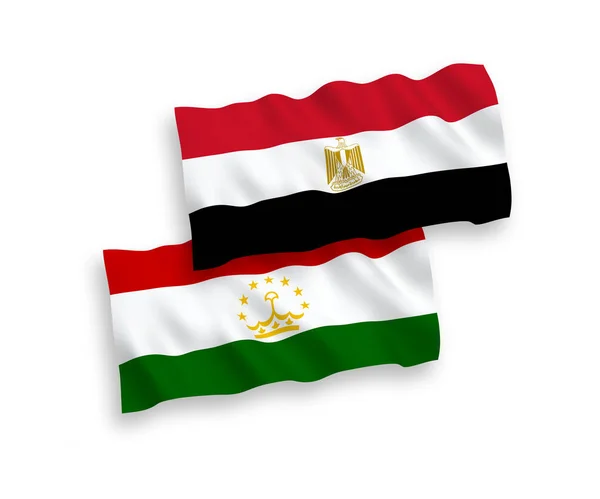 Vlaggen van Tadzjikistan en Egypte op een witte achtergrond — Stockvector