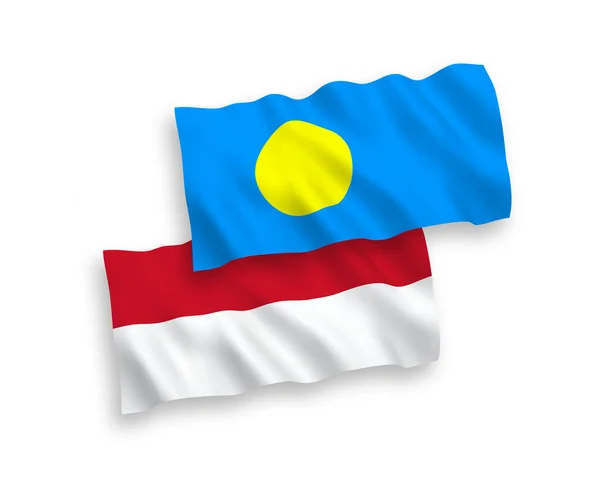 Vlajky Indonésie a Palau na bílém pozadí — Stockový vektor