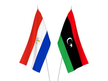 Libya ve Paraguay 'ın ulusal kumaş bayrakları beyaz arka planda izole edildi. 3d resimleme.