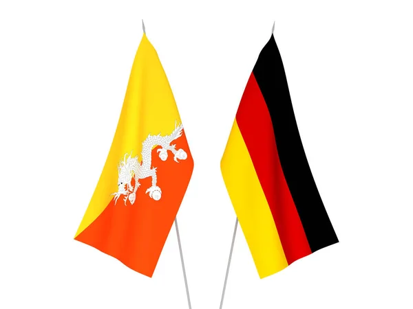 Germany and Kingdom of Bhutan flags — Stok fotoğraf