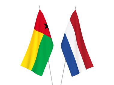 National fabric flags of Netherlands and Republic of Guinea Bissau isolated on white background. 3d rendering illustration.