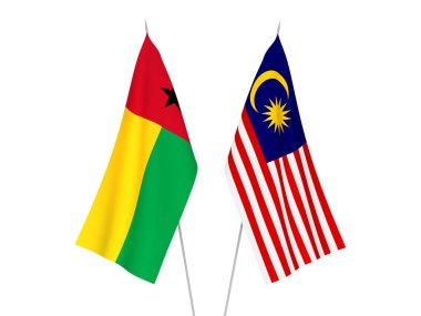 Beyaz arka planda Malezya ve Gine Bissau Cumhuriyeti 'nin ulusal kumaş bayrakları izole edildi. 3d resimleme.