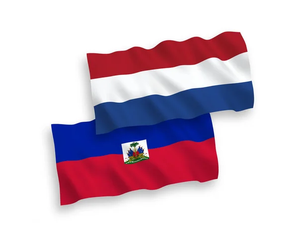 Bandiere della Repubblica di Haiti e dei Paesi Bassi su sfondo bianco — Vettoriale Stock