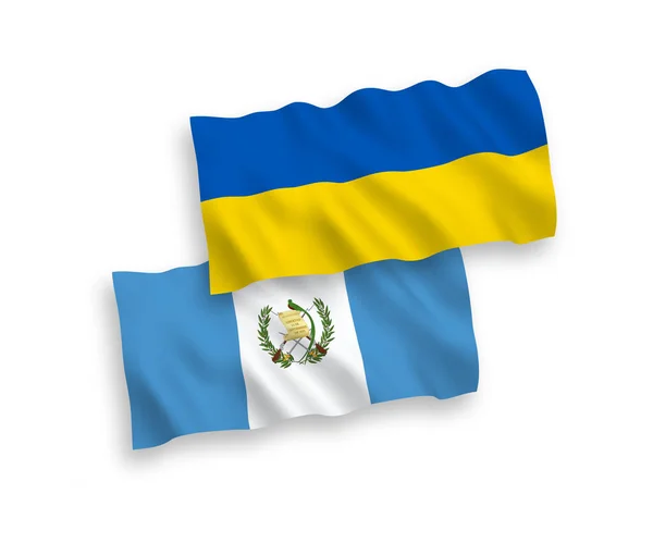 Drapeaux de la République du Guatemala et de l'Ukraine sur fond blanc — Image vectorielle