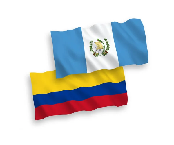 Vlaggen van de Republiek Guatemala en Colombia op een witte achtergrond — Stockvector