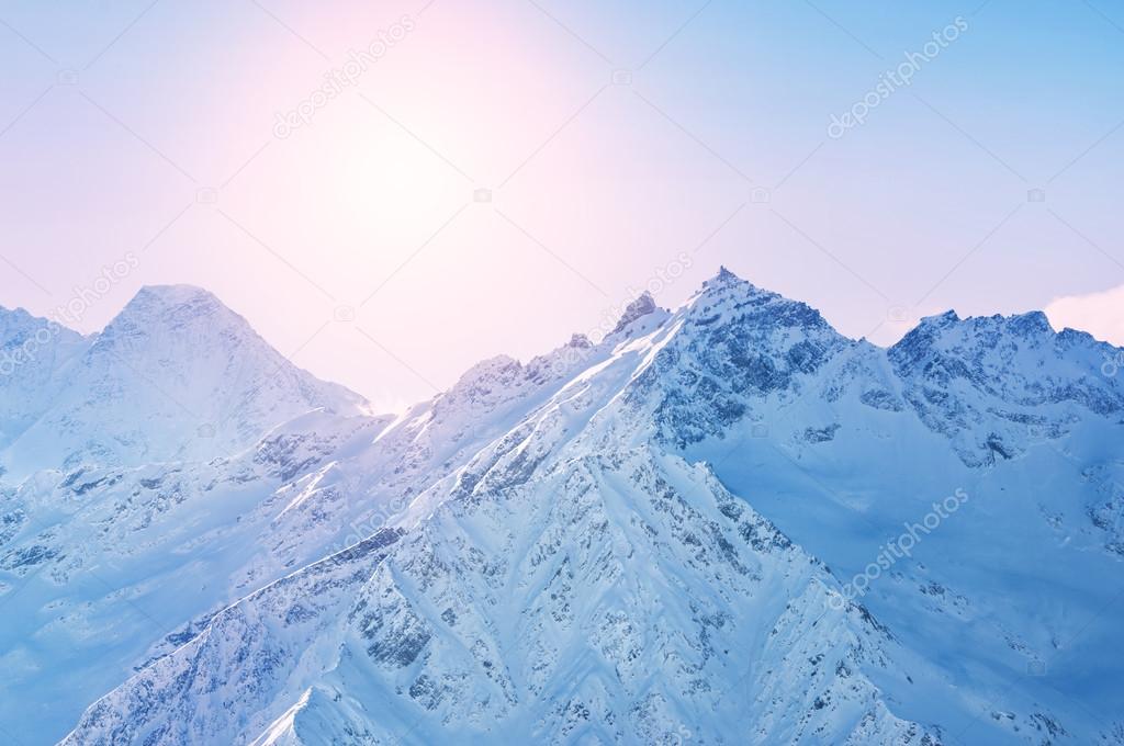 Winter snow covered mountains at sunset