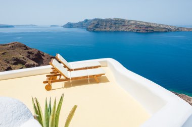 Sunbeds on the beach. Santorini island, Greece