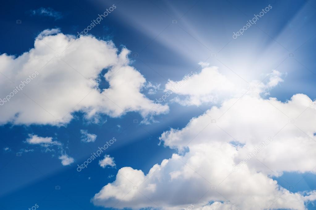 Beautiful blue sky with white clouds and sun. 