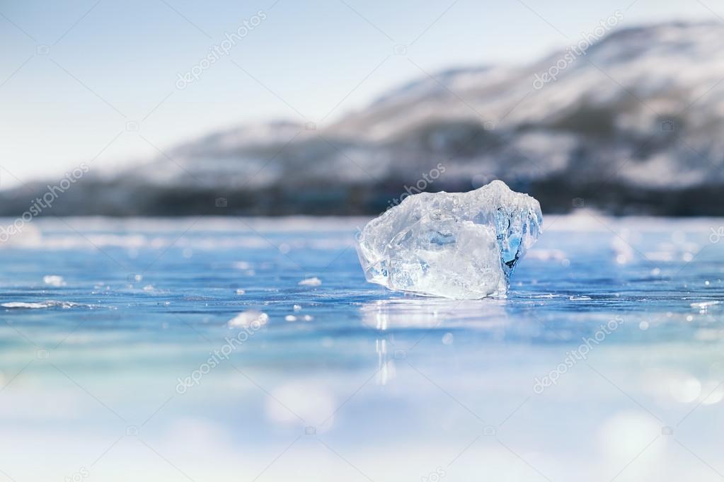 Icicle on the frozen lake