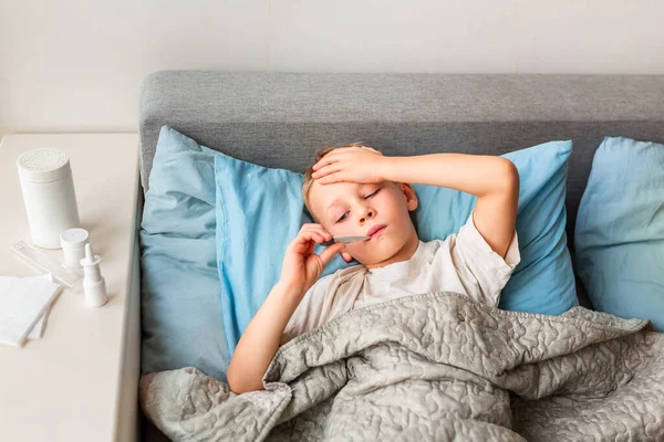 Sick Little Boy High Fever Headache Laying Bed Holding Thermometer — Stock Photo, Image