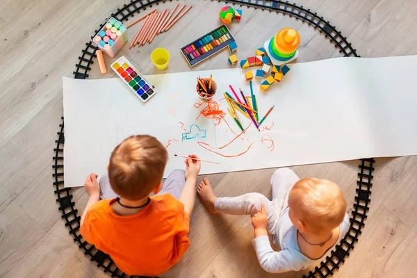 Preschool Boys Drawing Floor Paper Playing Educational Toys Blocks Train — Stock Photo, Image