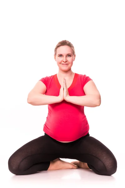 Terhes nő gyakorlása a elszigetelt fehér — Stock Fotó