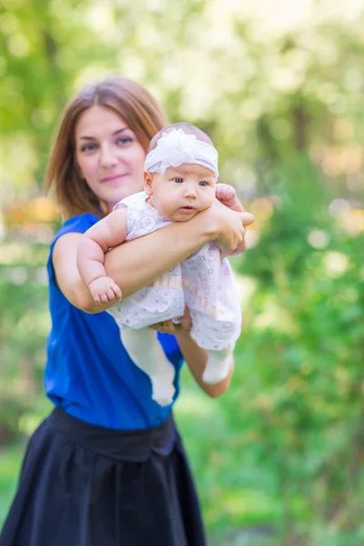 Beautiful mother and baby outdoor. — Stock Photo, Image