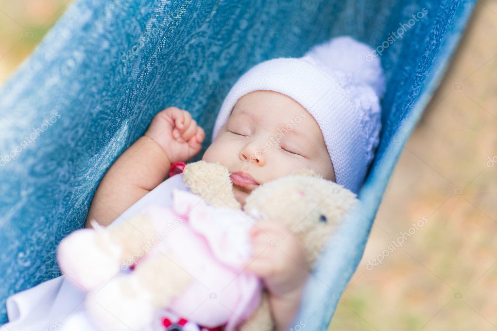 Cute little baby sleeping in the park