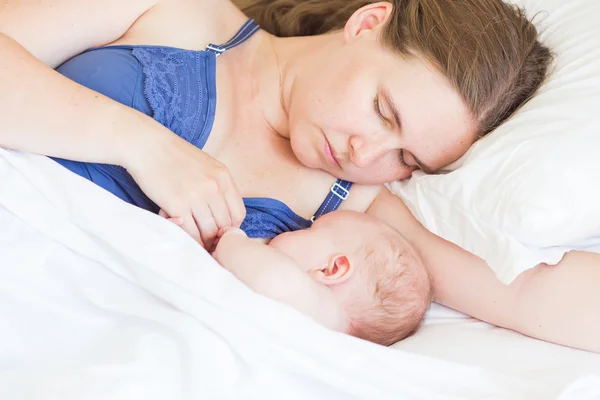 Happy mother breast feeding her baby infant — Stock Photo, Image