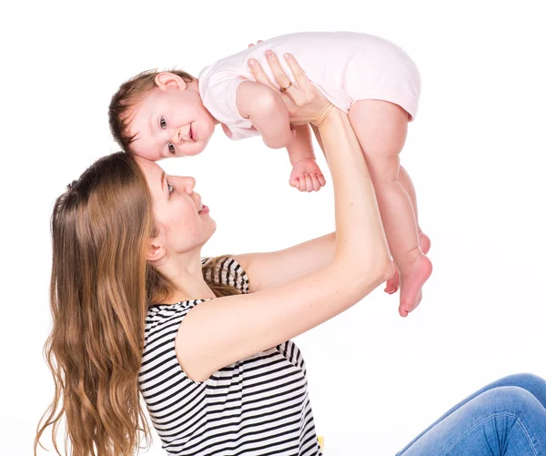 Beau bébé et mère jouant — Photo