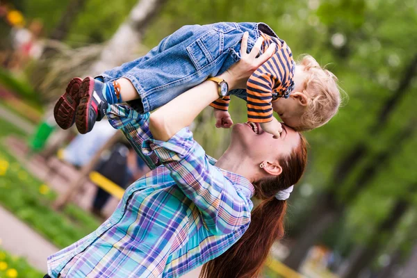 Happy mother with the baby playing — Stock Photo, Image