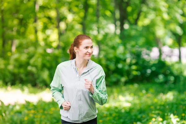 Fit sportive women jogging in the park