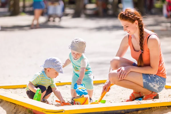 Mother playing with two baby boys — Stock Photo, Image