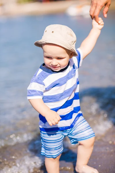 Cute little baby boy exploring the beach — Stok fotoğraf
