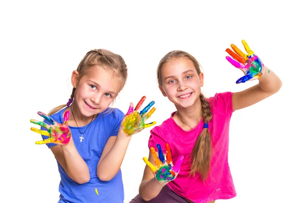 Happy girls with hands in paint — Stock Photo, Image