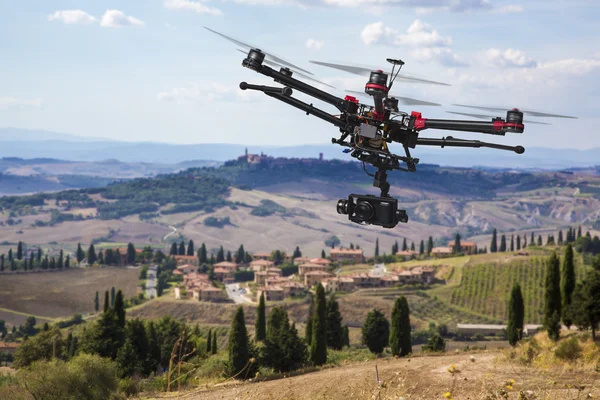 Flying drone in the skies of Tuscany Stock Picture