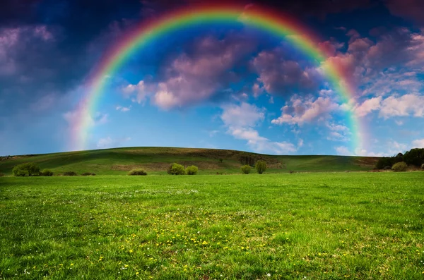 Rainbow and cloudy stormy sky — Stock Photo, Image