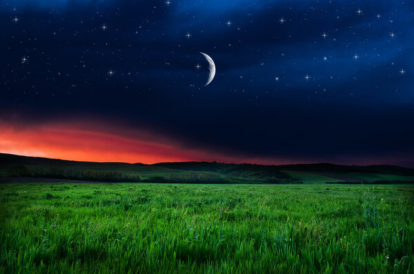 Beautiful night field background, growing moon, Elements of this image furnished by NASA.