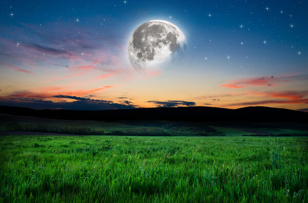 Beautiful night field background, Elements of this image furnished by NASA.