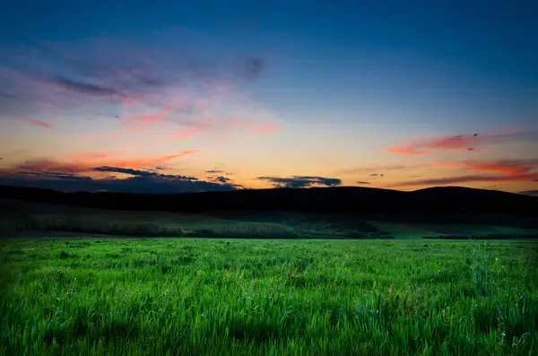 Field and dramatic sky view — Stock Photo, Image