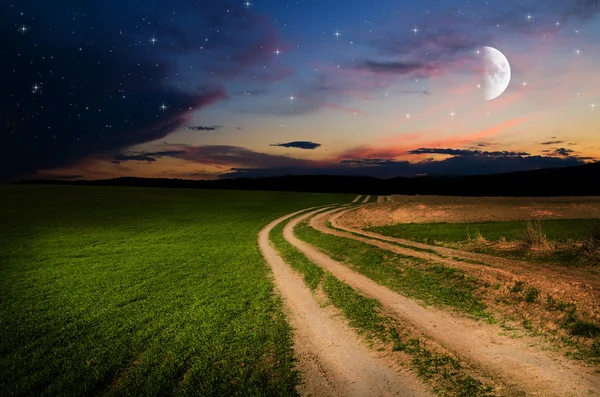 Estrada rural e céu com estrelas à noite — Fotografia de Stock
