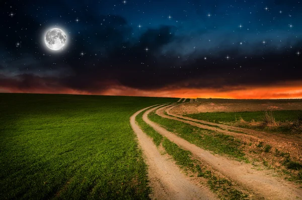 Rural road and sky with stars in the night — Stock Photo, Image