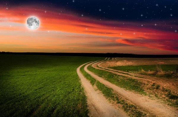 Rural road and sky with stars in the night — Stock Photo, Image