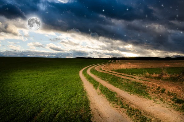 Rural road and sky with stars in the night — Stock Photo, Image