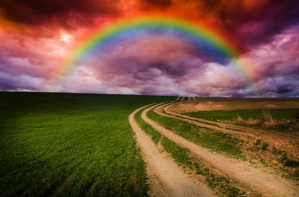 Rural road and rainbow in the night