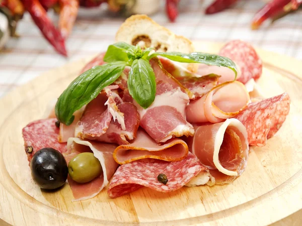 Ham plate. Different kind of meat on wooden board — Stock Photo, Image