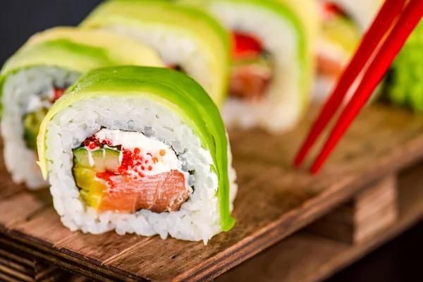 Sushi Rolls Avocado Salmon Fish Cream Philadelphia Cheese Tobiko Cucumber — 图库照片