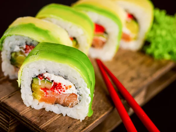 Sushi Rolls Avocado Salmon Fish Cream Philadelphia Cheese Tobiko Cucumber — Fotografia de Stock